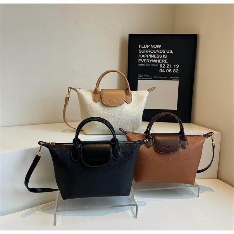 真皮高级质感小包包女春夏百搭2025新款时尚小众饺子包手提水桶包,箱包皮具/热销女包/男包,通用款女包,淘宝优惠券,粉丝福利购,淘宝优惠卷