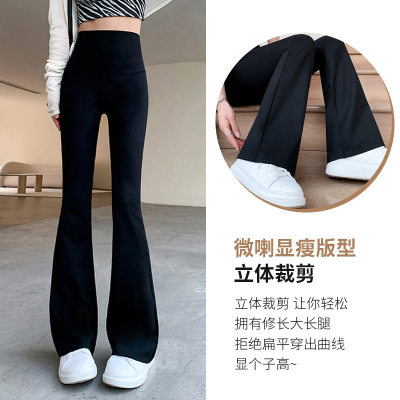 Shark pants worn outside black high-waisted slimming