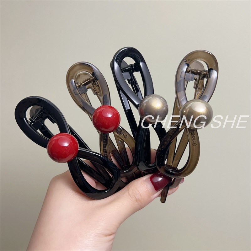 蝴蝶结珍珠一字抓夹女感2024新款扭扭发夹后脑勺盘发夹子头饰