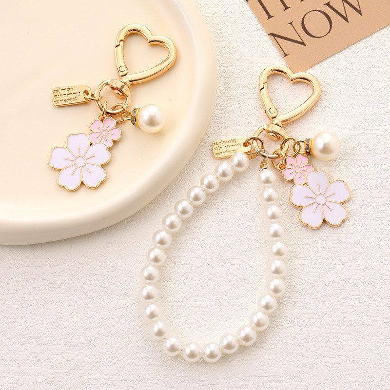 韩系ins双色樱花珍珠链包挂手腕式手机挂件时尚百搭包包挂件配饰,节庆用品/礼品,挂饰/生肖挂饰,淘宝优惠券,粉丝福利购,淘宝优惠卷