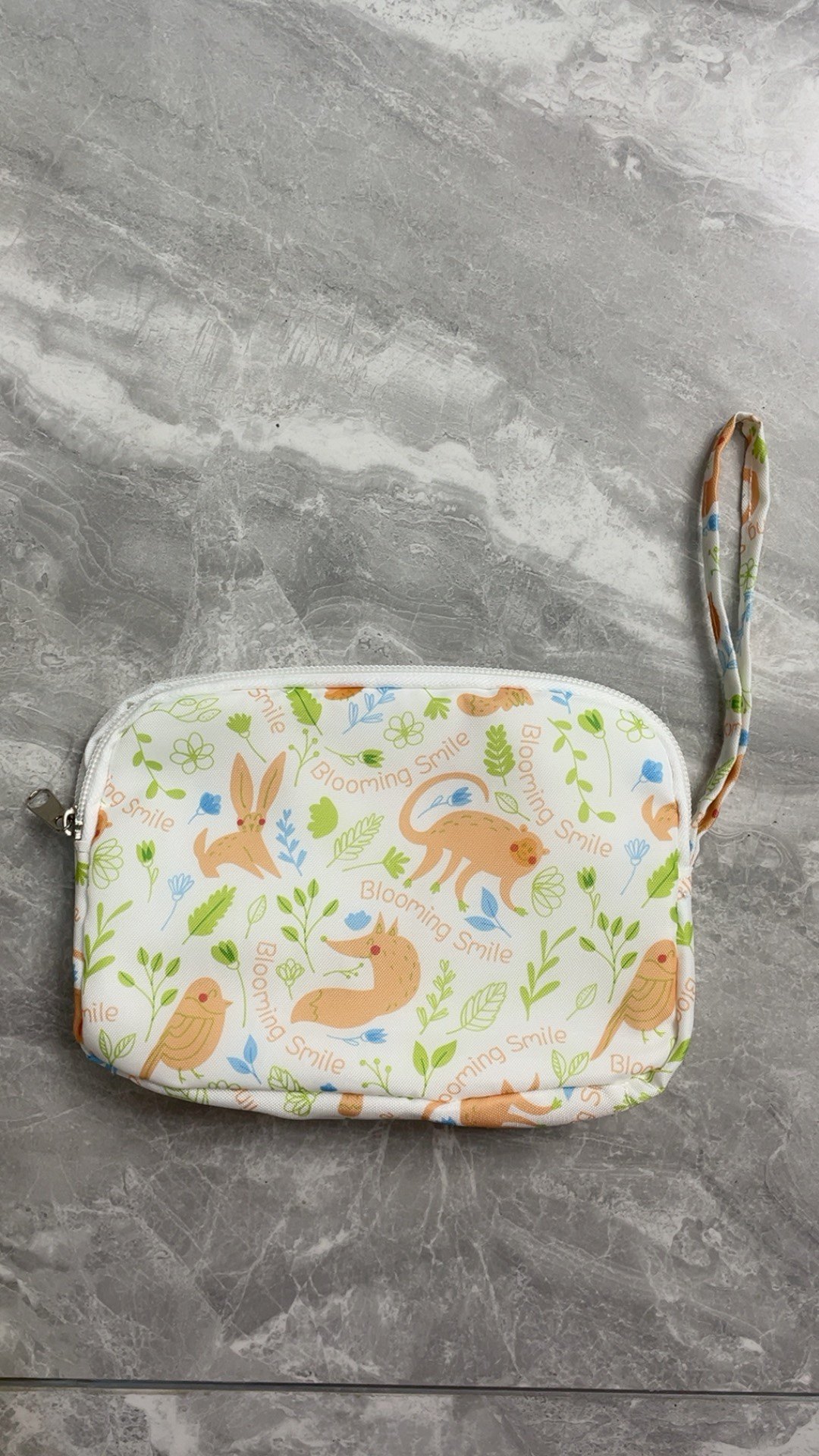 笑脸包手拿包笑容满溢手拿包品牌礼品