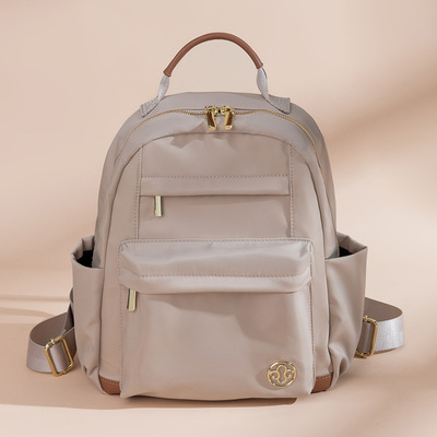 韩版休闲女双肩包简约轻便大容量旅行包大学生书包通勤电脑背包潮