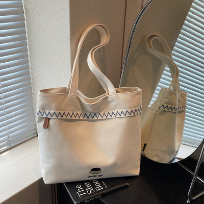 帆布包大容量结实特大号刺绣多口袋厚实秋冬百搭韩版妈咪腋下单肩