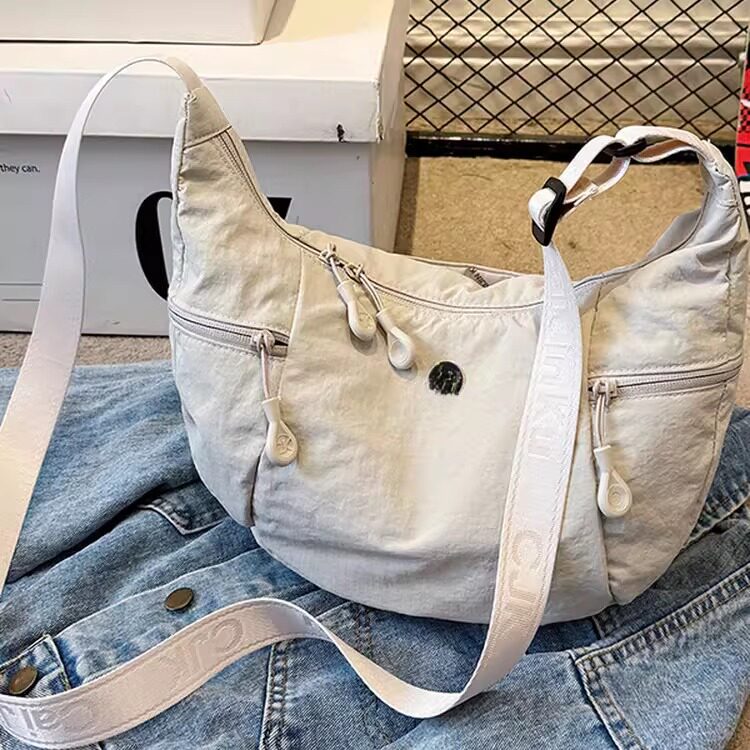 日系超轻防水布包男女百搭单肩斜挎包多功能尼龙轻便大容量牛角包