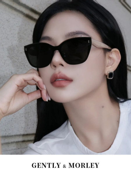 Black cat-eye sunglasses worn by a model