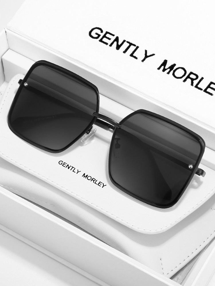 Black square sunglasses displayed on a white box