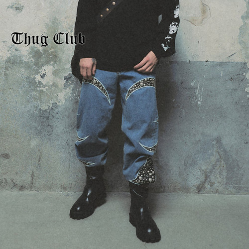 THUGCLUB铆钉皮革拼接牛仔裤