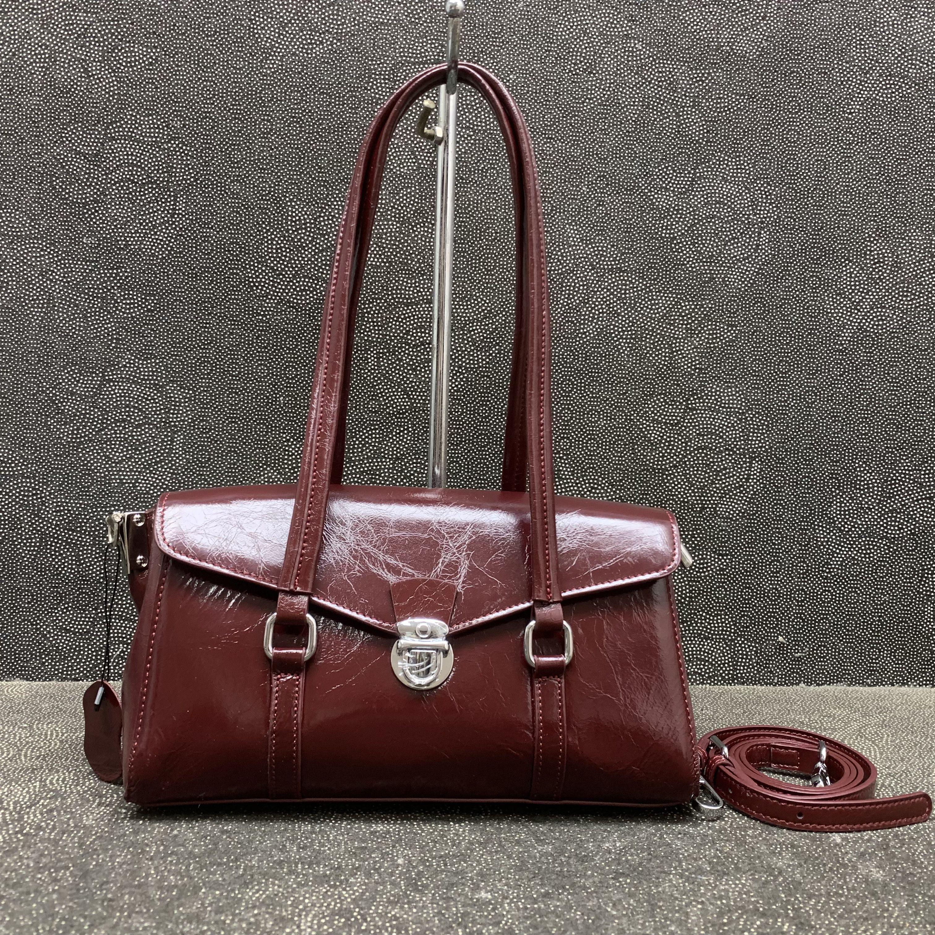 熙熙狸头层牛皮腋下法棍包