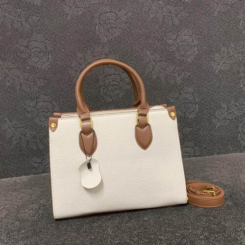 熙熙狸头层牛皮撞色单肩包