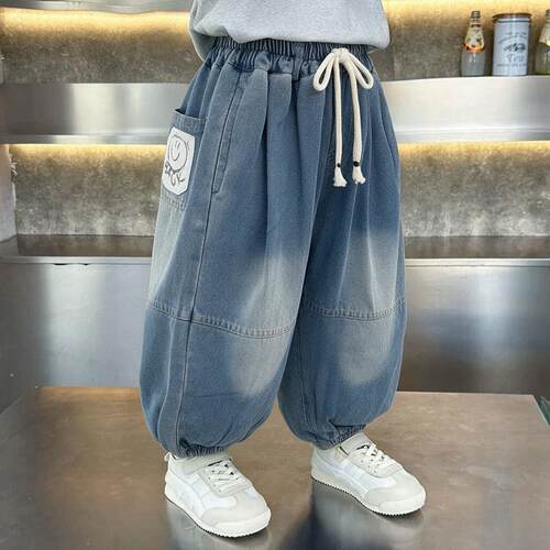 春秋季宝宝宽松版拼接牛仔裤笑脸