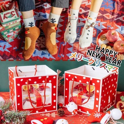Four pairs of boxed Christmas socks for men and women home