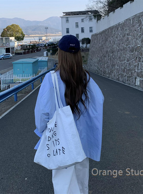 韩系慵懒氛围感白色字母帆布包ins风大容量印花单肩包简约托特包