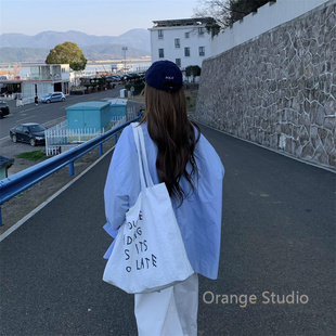 韩系慵懒氛围感白色字母帆布包ins风大容量印花单肩包简约托特包