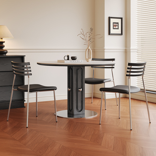 侘寂风洞石岩板圆桌家用黑白色饭桌小户型复古风包豪斯实木餐桌