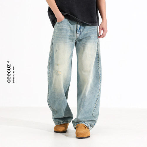 设计感水洗破洞弯刀牛仔裤