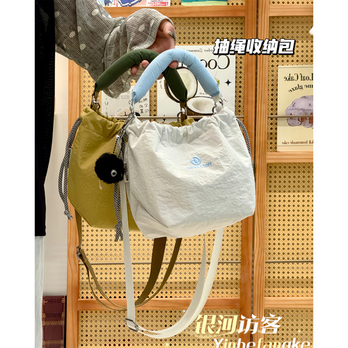 新款复古休闲手提水桶包小众设计抽绳收纳斜挎包百搭通勤旅行包包