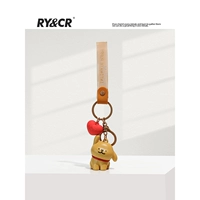 Линейный щенок сидит с наклоненной головой - коричневый