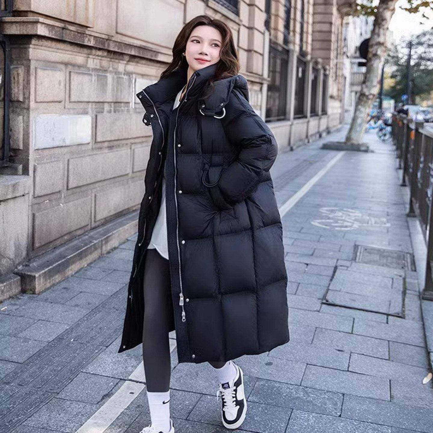 鸭绒过膝黑色羽绒服外套中长款2025女冬新款收腰宽松加厚连帽大衣