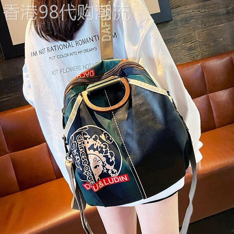 代购牛津布拼真皮后揹包2025新款潮时尚国潮大容量通勤揹包女士包