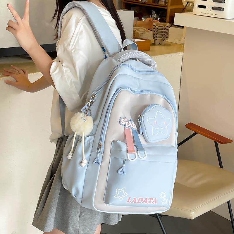 书包女生小学生三到六年级减负护脊超轻便大容量初中生双肩包新款