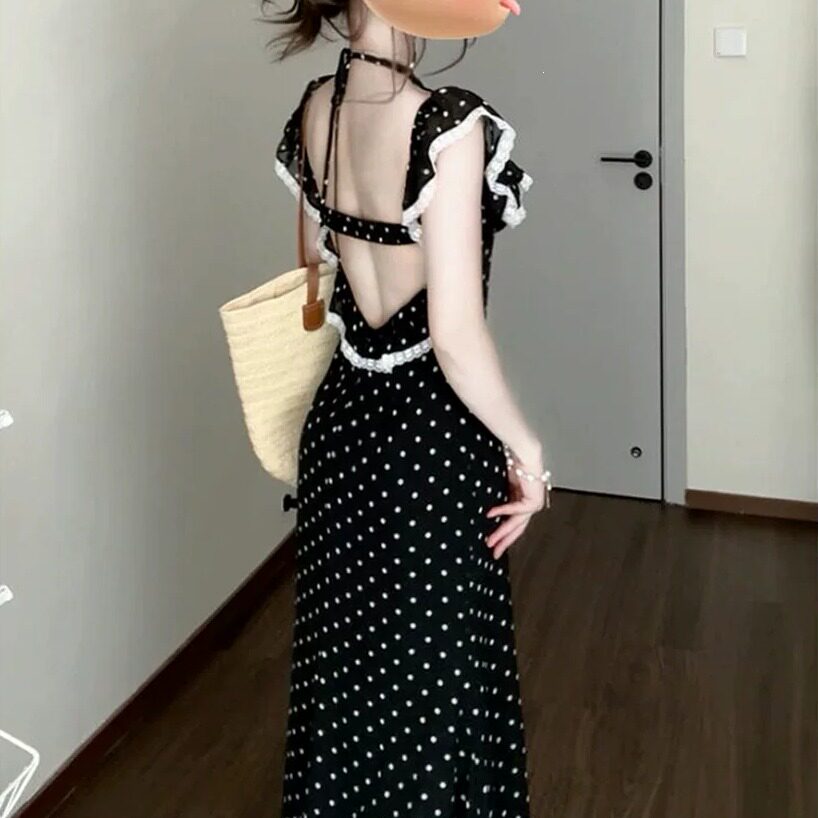 黑色荷叶边吊带连衣裙女2026新款高级感气质波点修身显瘦包臀长裙