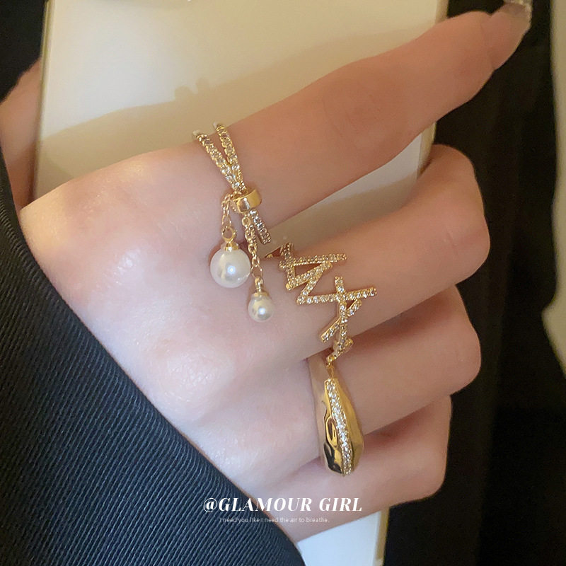 真金电镀锆石珍珠流苏交错