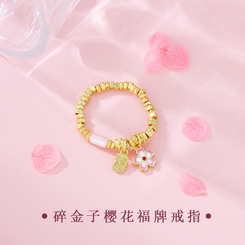 日本portney bell蹦迪珠古法福牌樱花爆闪花朵女弹力戒指新款