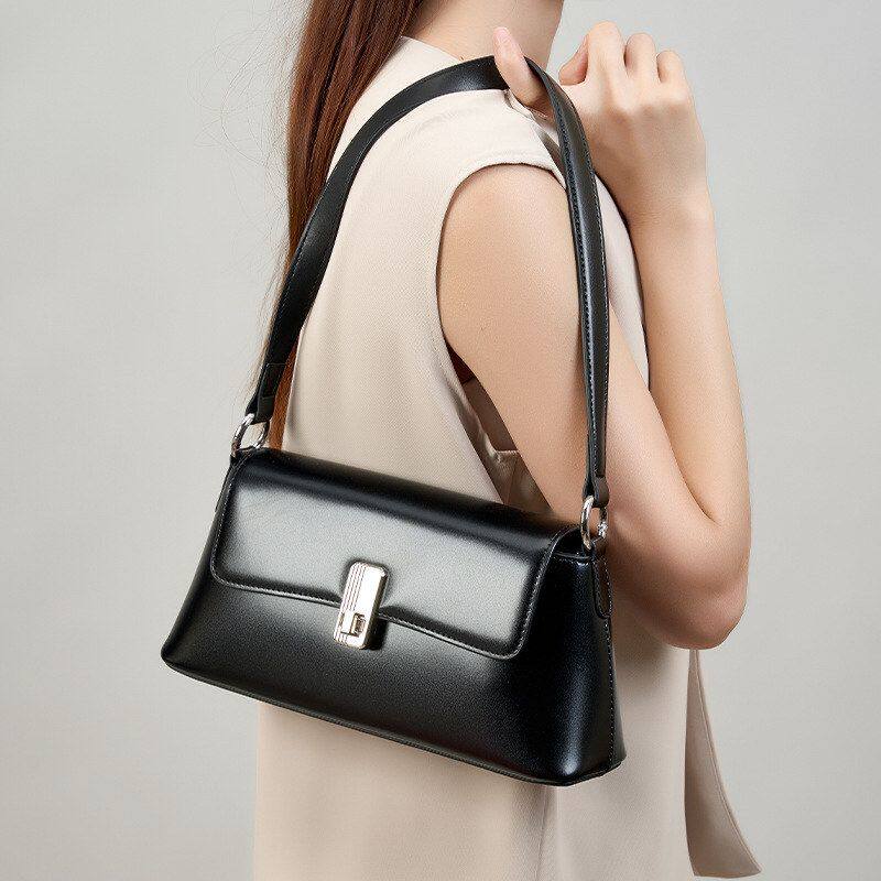 韩系女生黑色通勤斜挎女士单肩包真皮小众法式高级感法棍腋下包