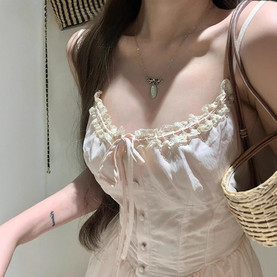 法式温柔粉色蝴蝶结吊带连衣裙女夏超仙蕾丝花边拼接收腰a字长裙-