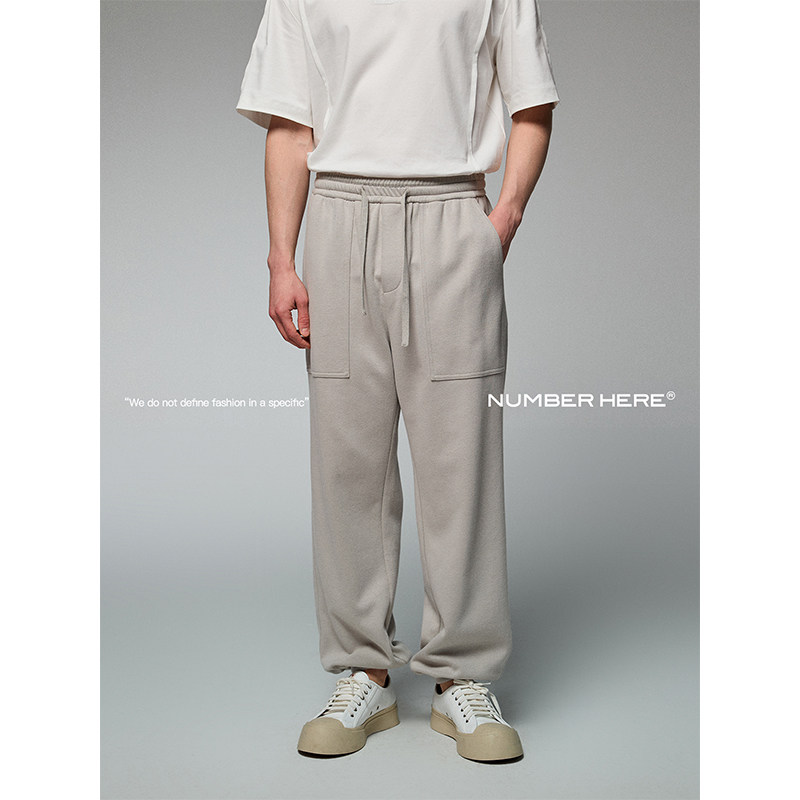 NUMBER HERE肌理棉质混纺面料拼接收口束脚休闲长裤24100124086