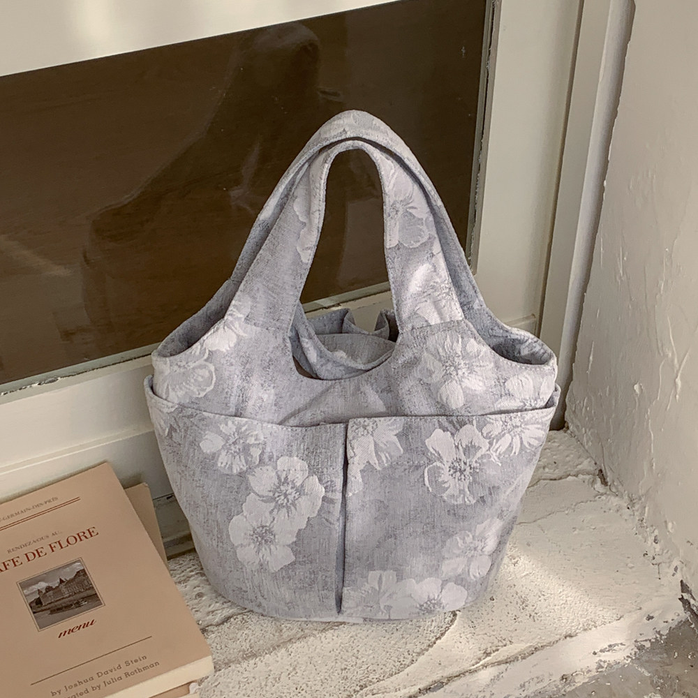 轻便帆布水桶包女手提小拎包2026春季新款时尚百搭日常上班通勤包