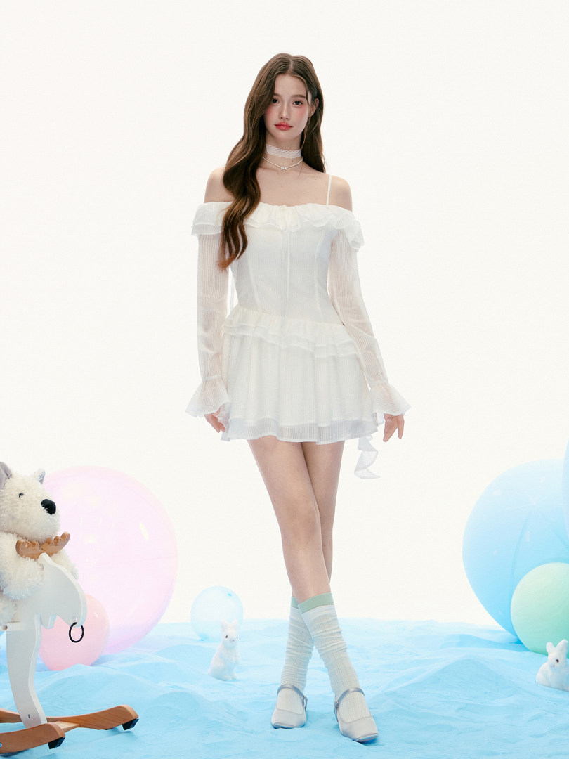 Model wearing a white off-shoulder ruffled dress