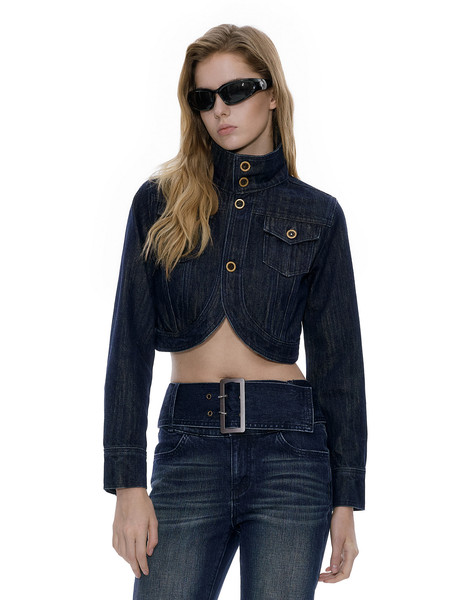 Model wearing a dark denim cropped jacket and matching jeans with sunglasses