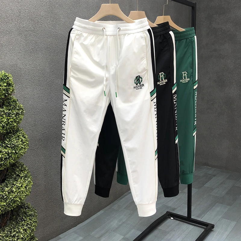 欧佐士尚沪休闲男装专卖店修身束脚印花百搭休闲裤弹力潮流运动裤