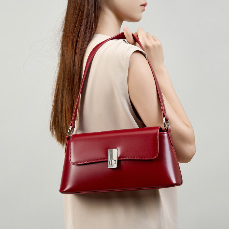 红色斜挎女士新款通勤手提单肩包法棍小众法式高级感真皮腋下包