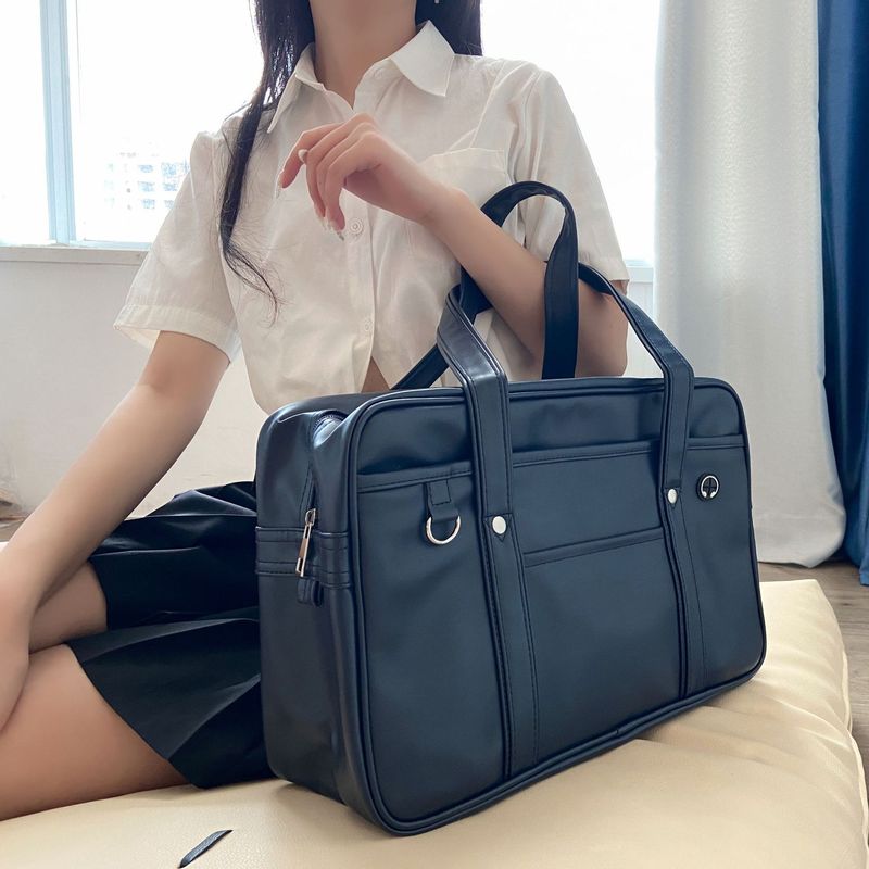 日本学生jk书包高中生女单肩手提PU制服包耐磨防水COS男女公文包