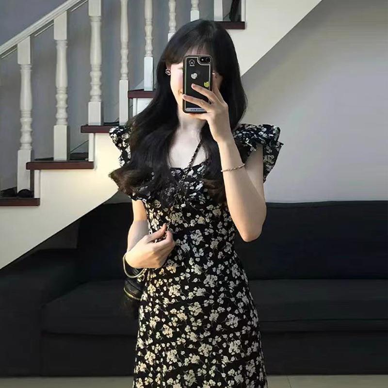 茶歇法式赫本风黑色碎花连衣裙子女夏季2025新款气质收腰长裙高级