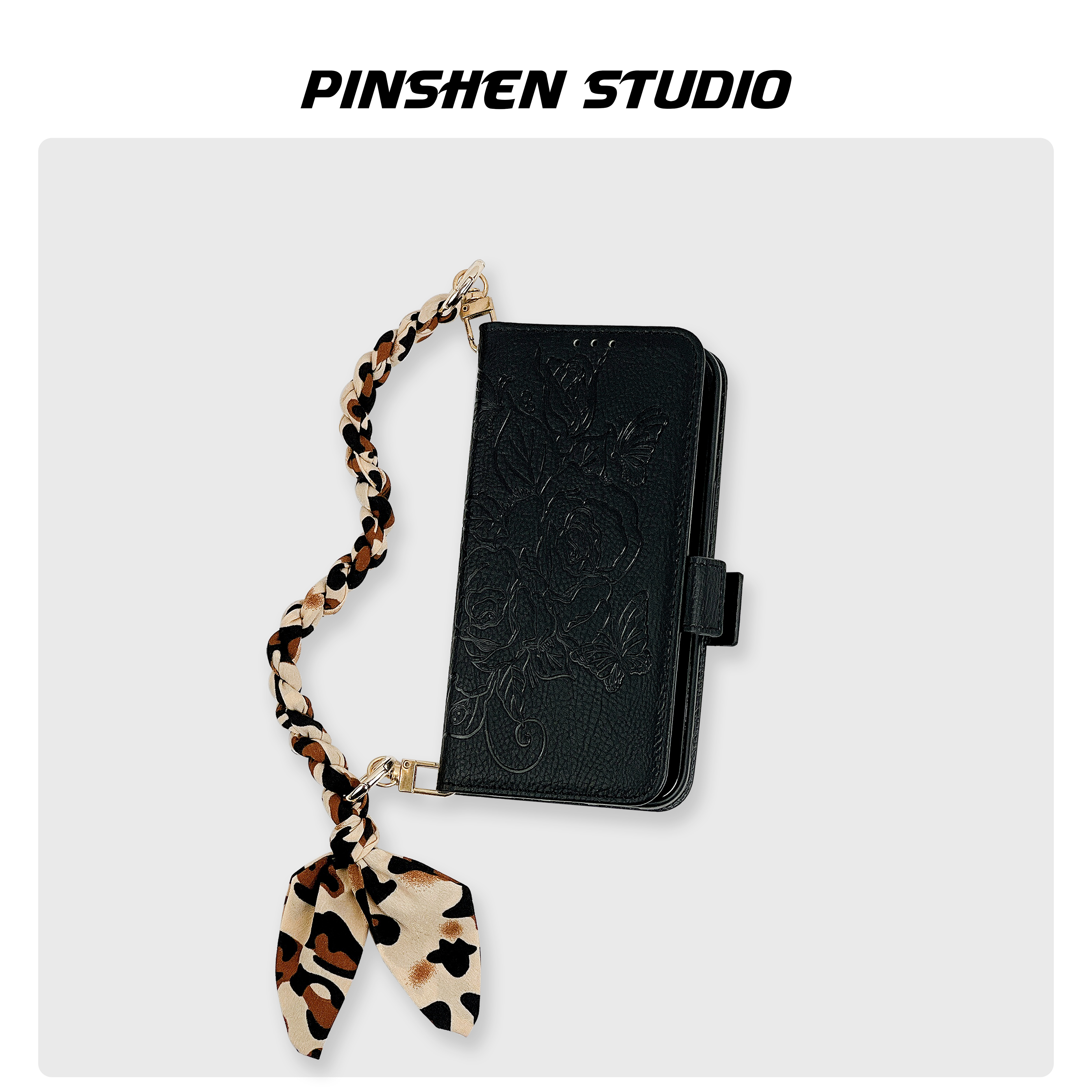 磁吸翻盖黑色花朵压纹手提手机壳