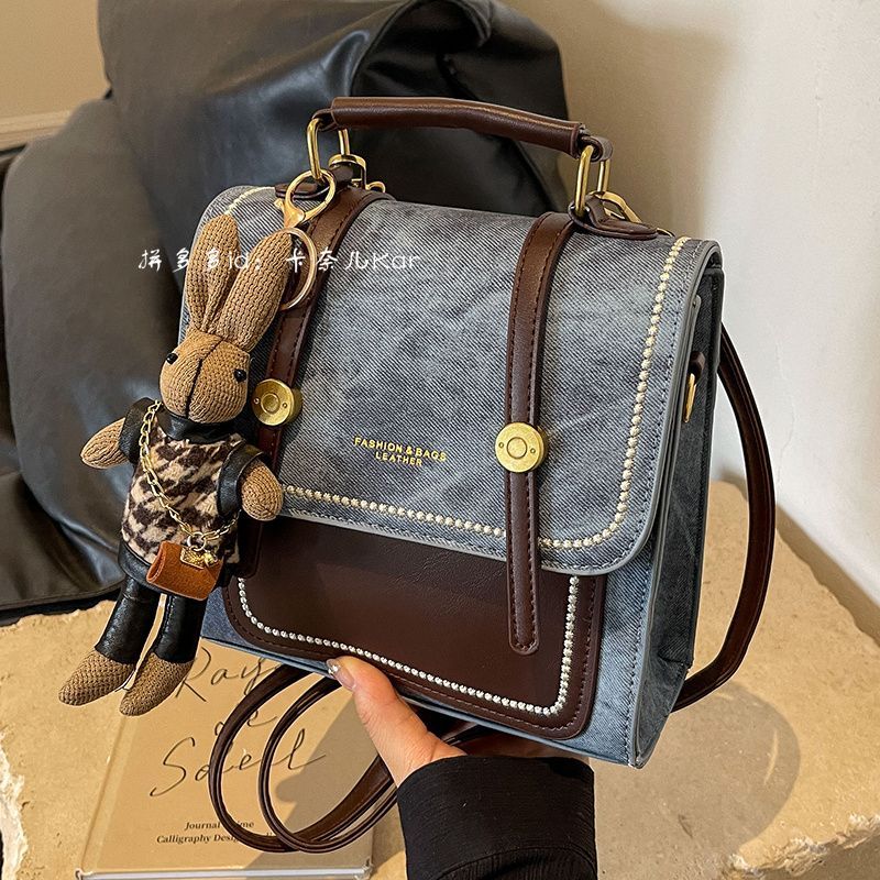 高级感小型牛仔一包三用双肩包女2025新款时尚斜挎短途旅行小背包