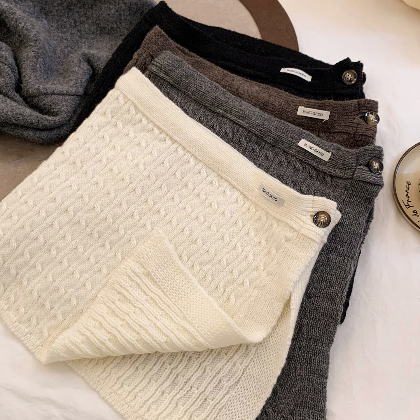 韩系氛围感纽扣针织毛线屁帘女秋冬保暖百搭叠穿半身裙子2025新款