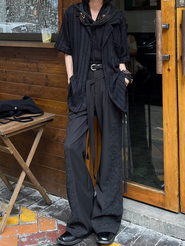 以休眠拼接设计微喇叭复古西裤