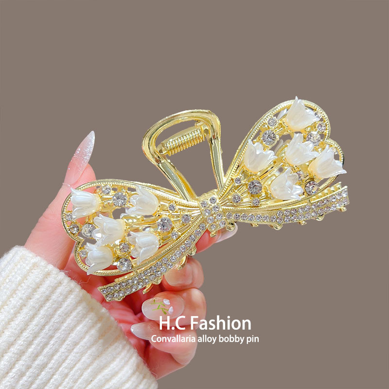 感蝴蝶结铃兰抓夹女气质简约百搭后脑勺盘发卡精致鲨鱼夹饰品