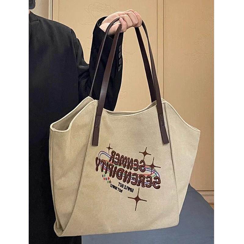 单肩包斜挎包女包包通勤爆款小众新款百搭休闲帆布高级感托特包