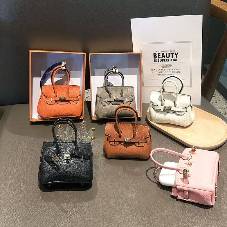 新款高颜值迷你蓝牙耳机收纳包多功能挂件创意口红包钥匙装饰挂件,3C数码配件,数码收纳整理包,淘宝优惠券,粉丝福利购,淘宝优惠卷