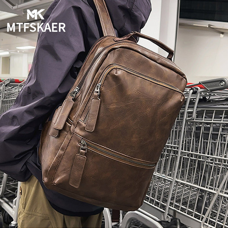 香港MTFSKAER真皮男双肩包
