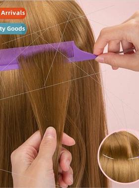 Hair salon picks up hair hook hair wh a sharp tail comb