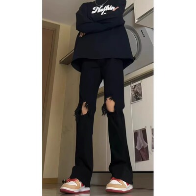 纯黑色破洞毛边牛仔裤男