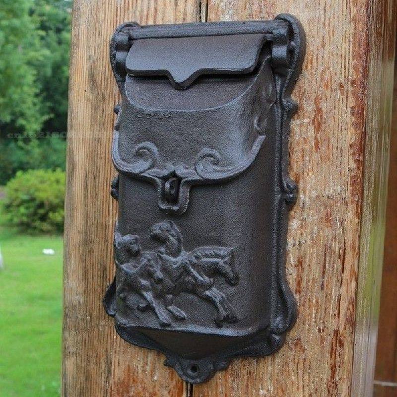 vintage cast iron wall mounted mailbox with five horses