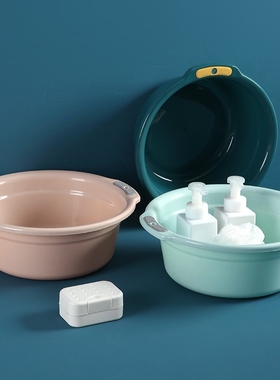 The family washes their clothes with a plastic pot and a nic