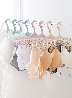 She's at home with eight-packed undergarments and a hanger w